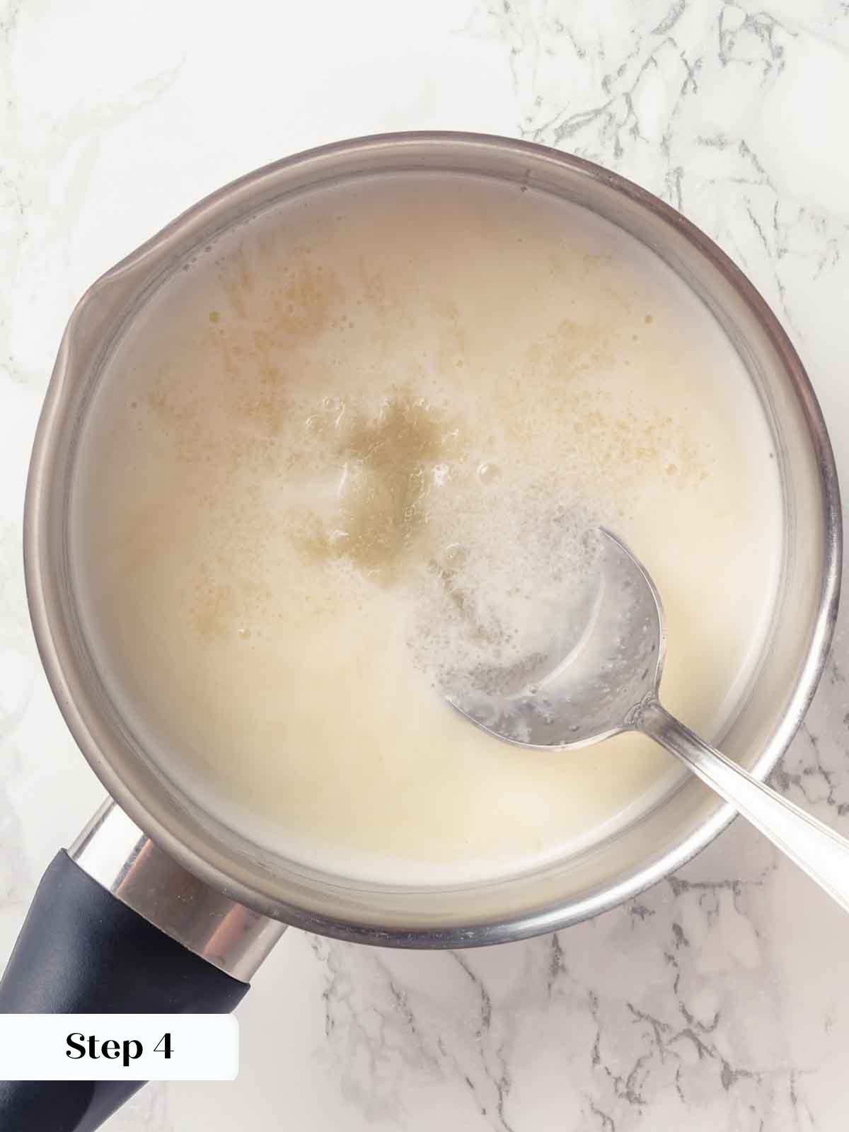 melting bloomed gelatin in hot cream.