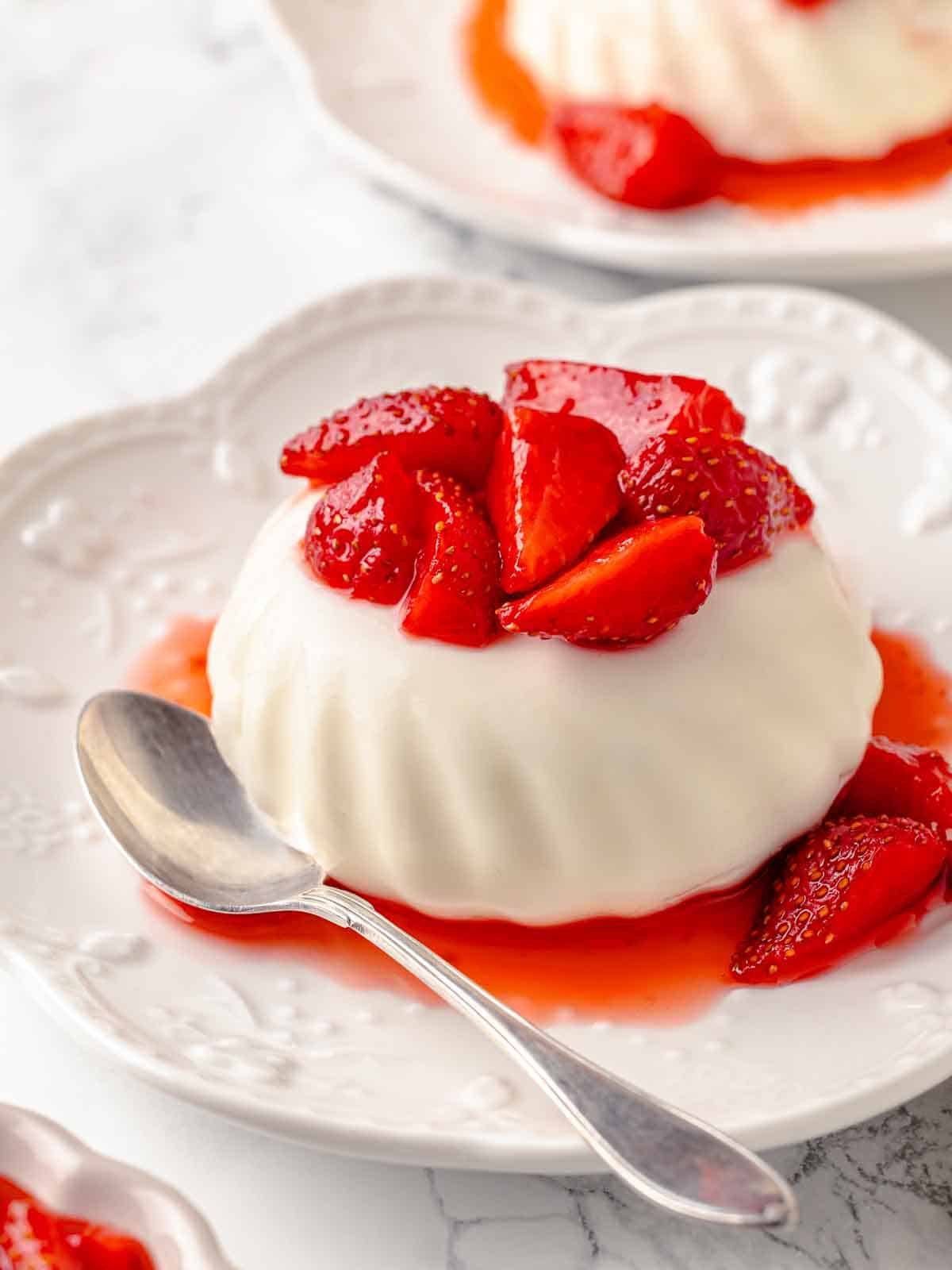 unmolded buttermilk panna cotta with strawberries.