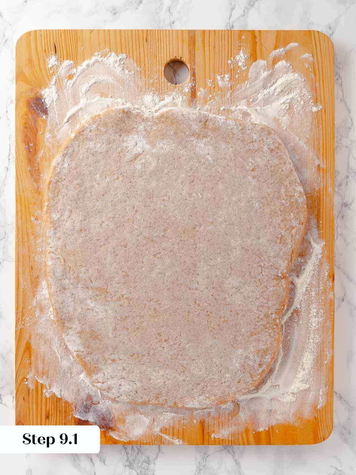 Flattened apple cider donut dough being prepared.