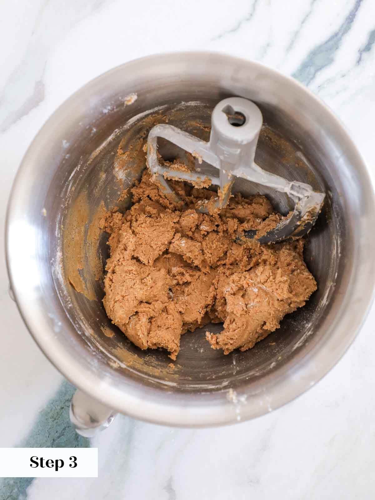 Cinnamon sugar cookie dough mixed in a stand mixer.