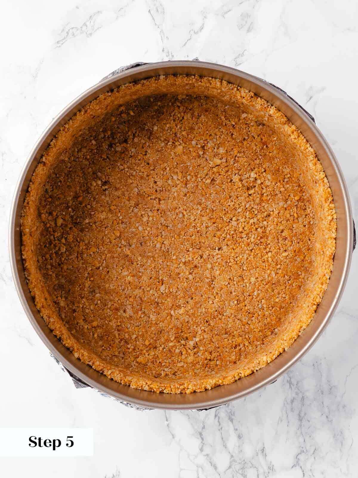 The process of making pumpkin cheesecake cookie crust.