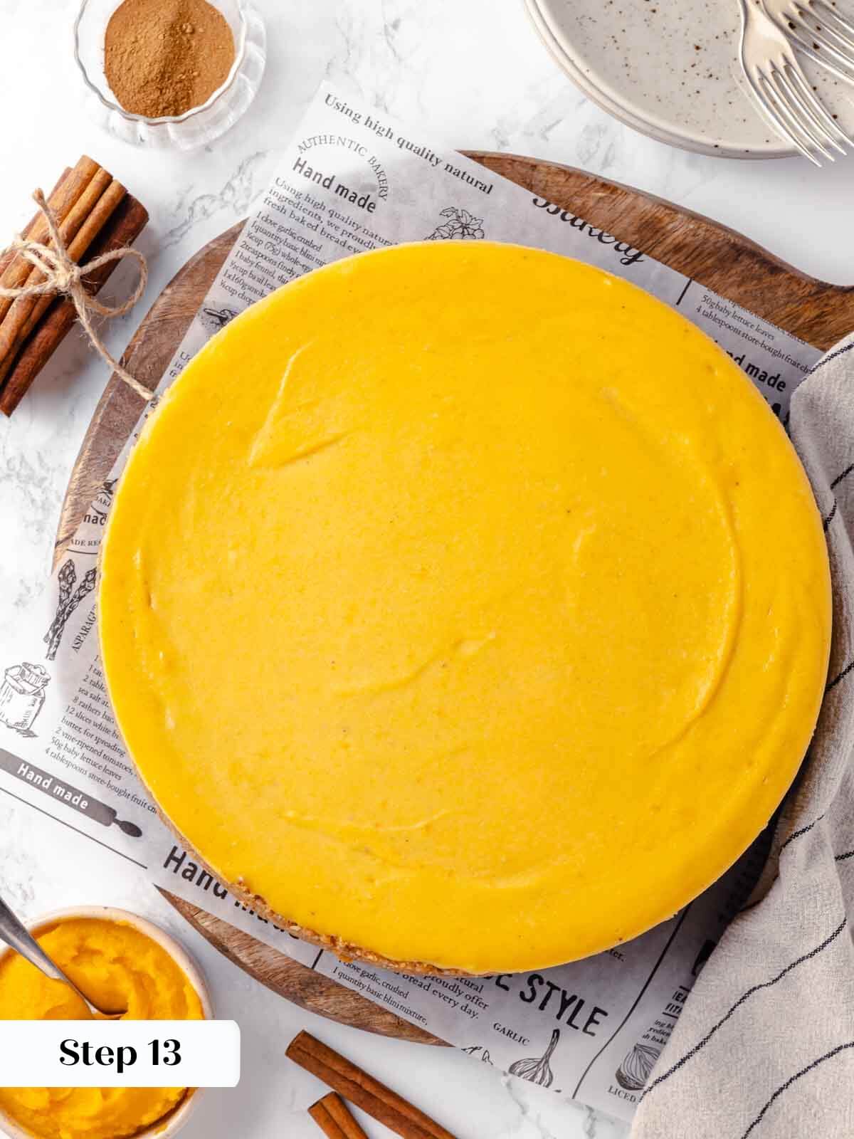 The process of cooling a pumpkin cheesecake.