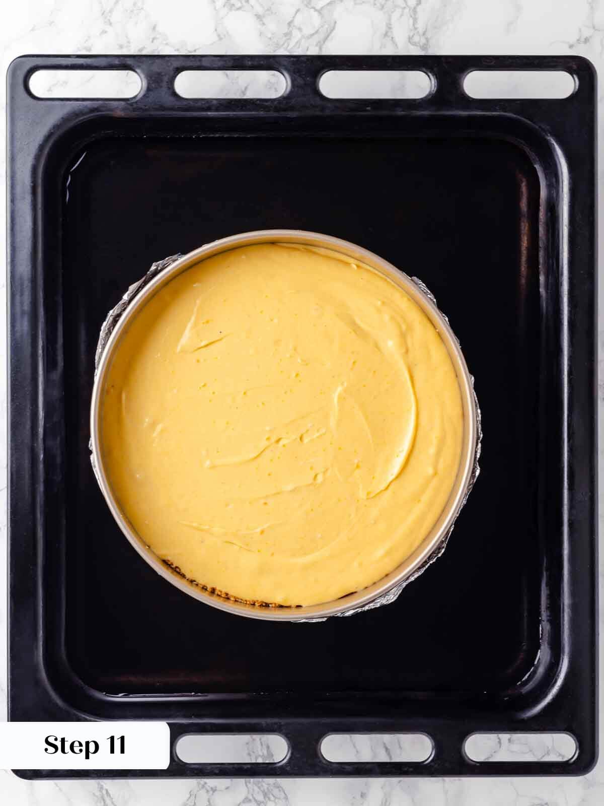 The water bath used in pumpkin cheesecake preparation.