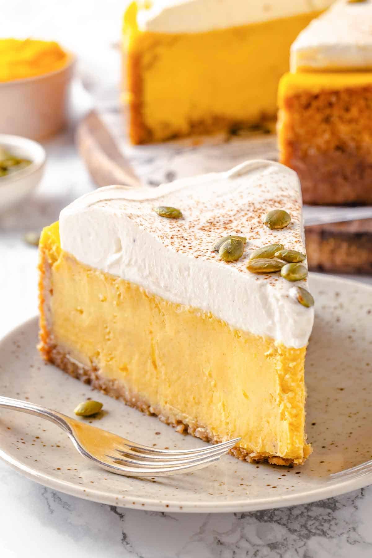 Pumpkin cheesecake topped with pumpkin seeds.
