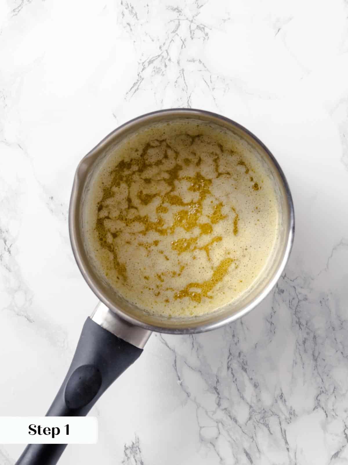 Butter melting in a saucepan for the applesauce cake.