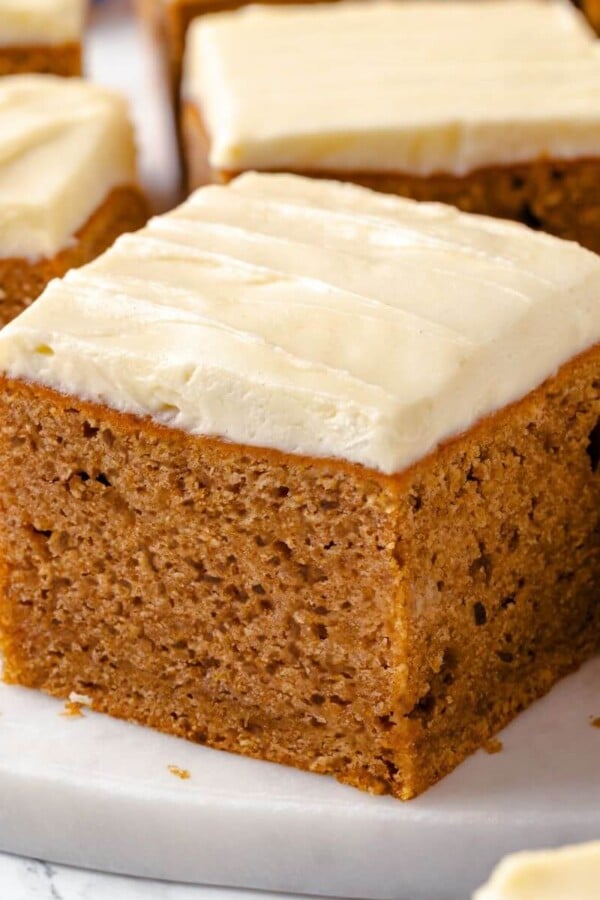 Applesauce cake displayed on a clean white countertop.