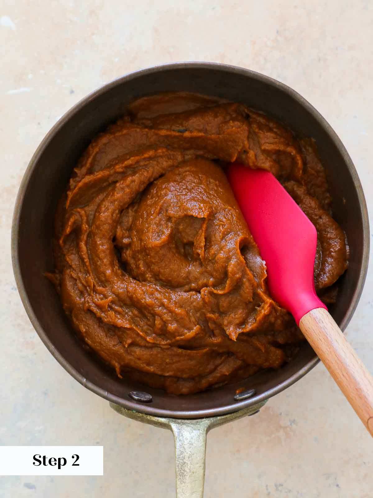 cooked pumpkin butter in copper pot.