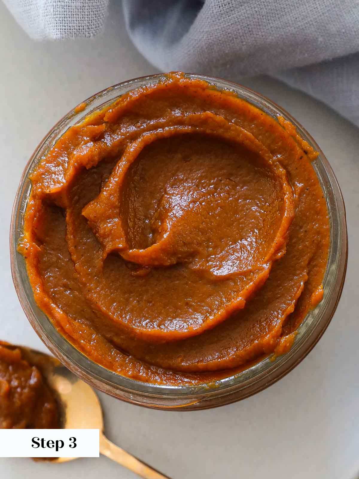 jarred pumpkin butter with swirl.