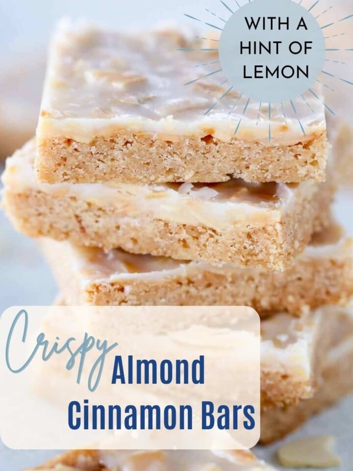 Almond bars with a golden crust, cut into squares and stacked.