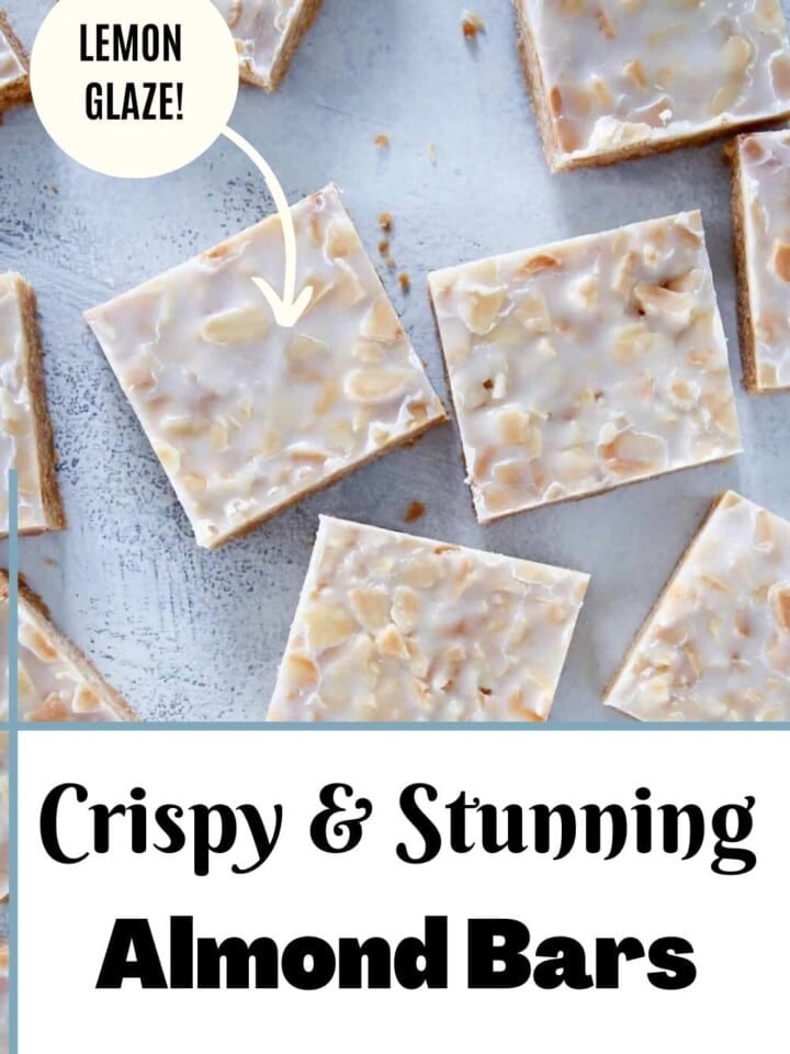 Close-up of golden almond bars on a white plate.