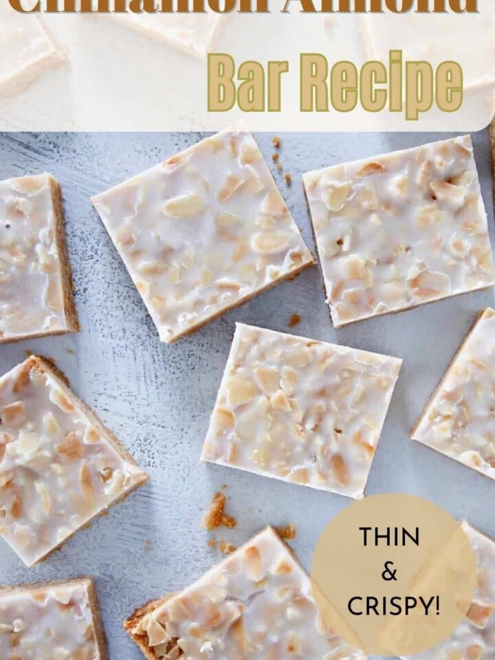 Almond bars cut into squares and served on a white platter.