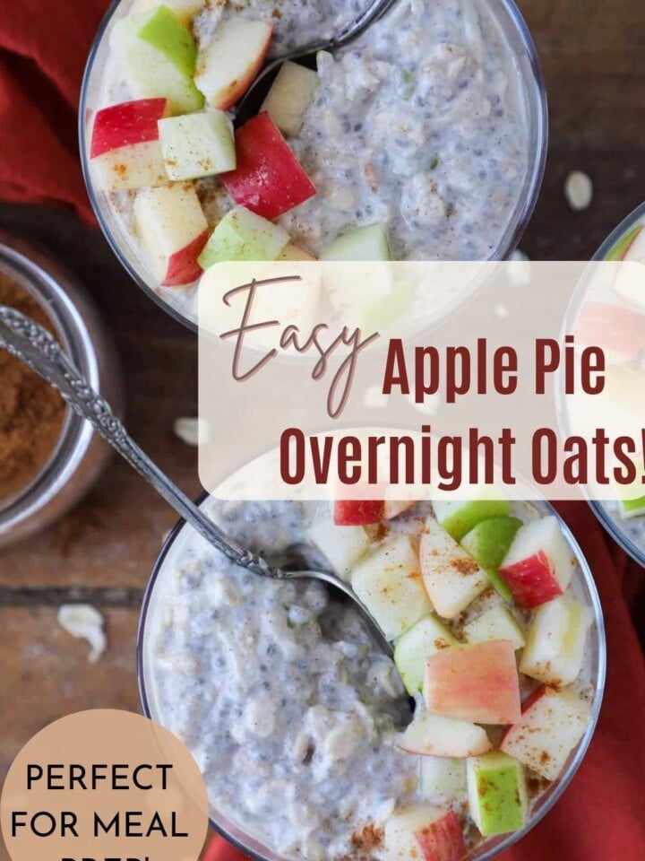 A glass jar filled with apple pie overnight oats topped with cinnamon and apples.