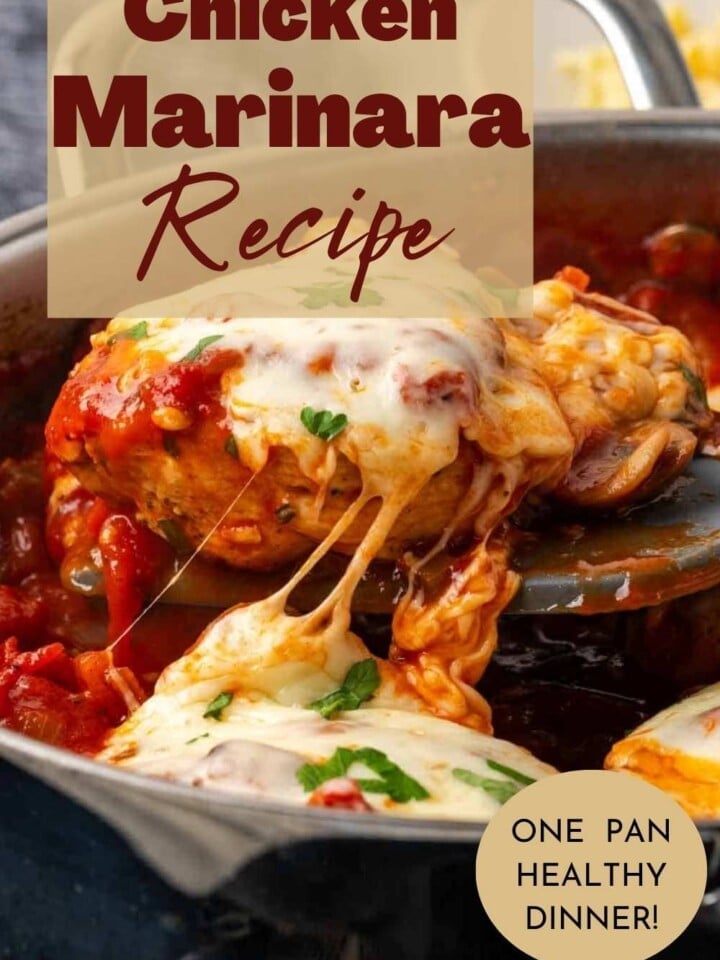 Baked chicken marinara with melted cheese and garnished with fresh basil.