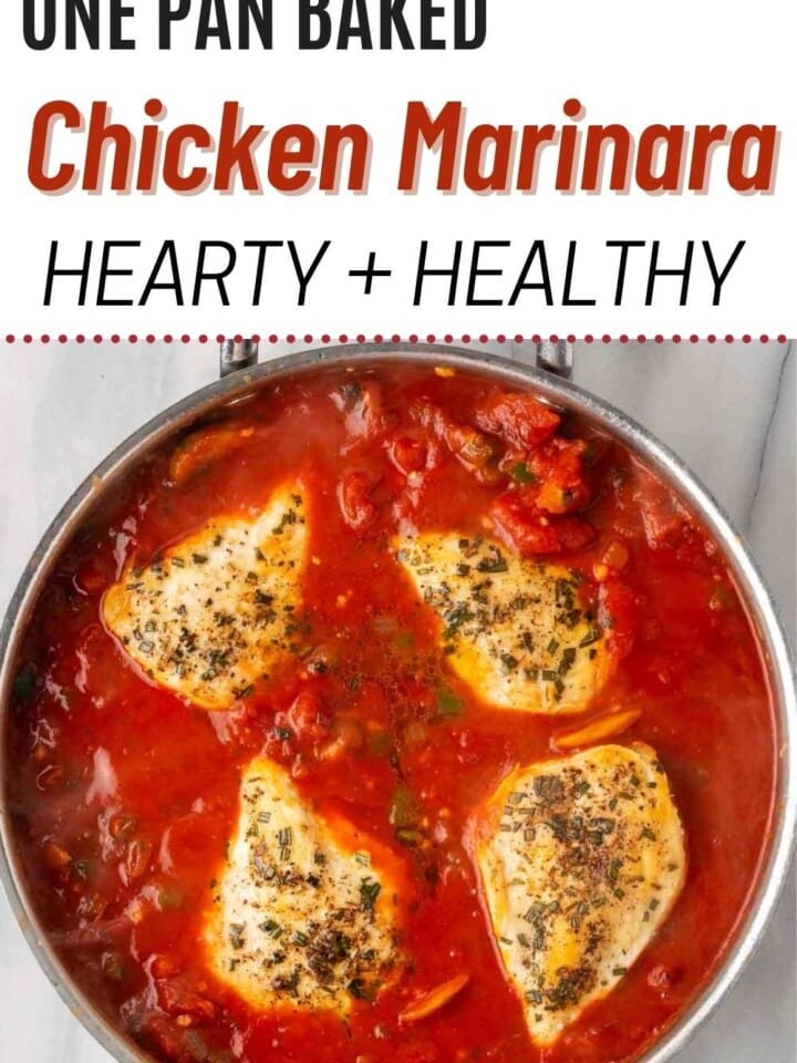 Golden baked chicken marinara with bubbly cheese in a pan.