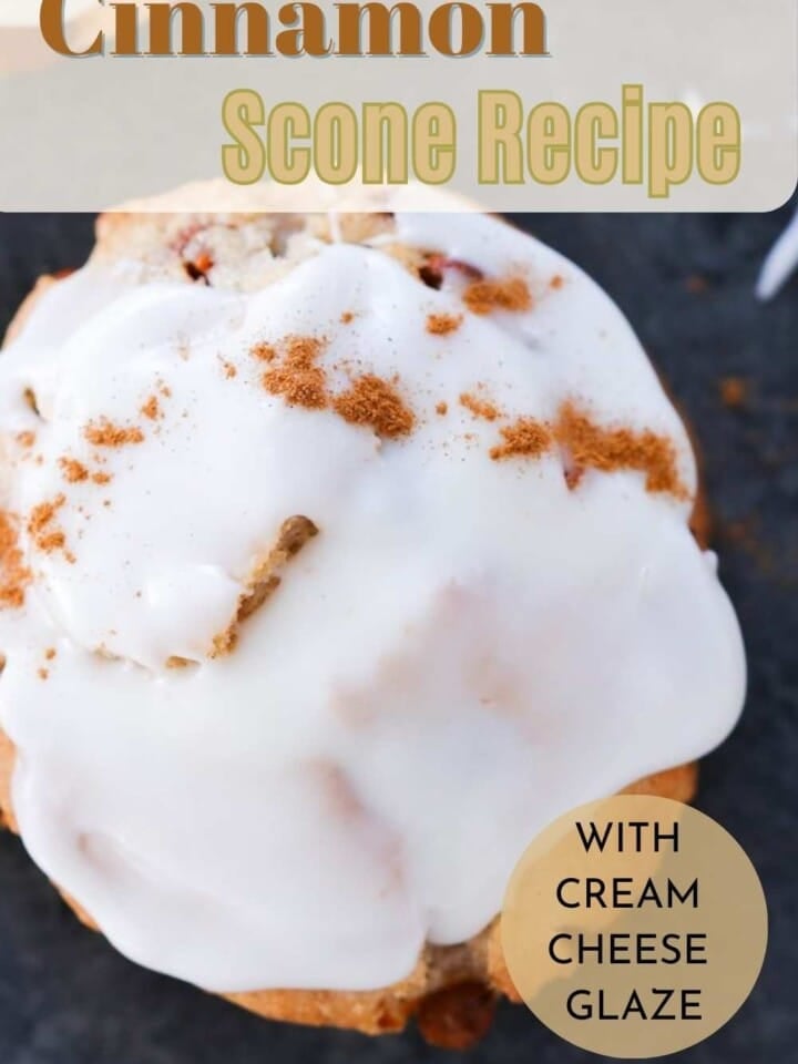 A close-up of flaky cinnamon scones with glaze.