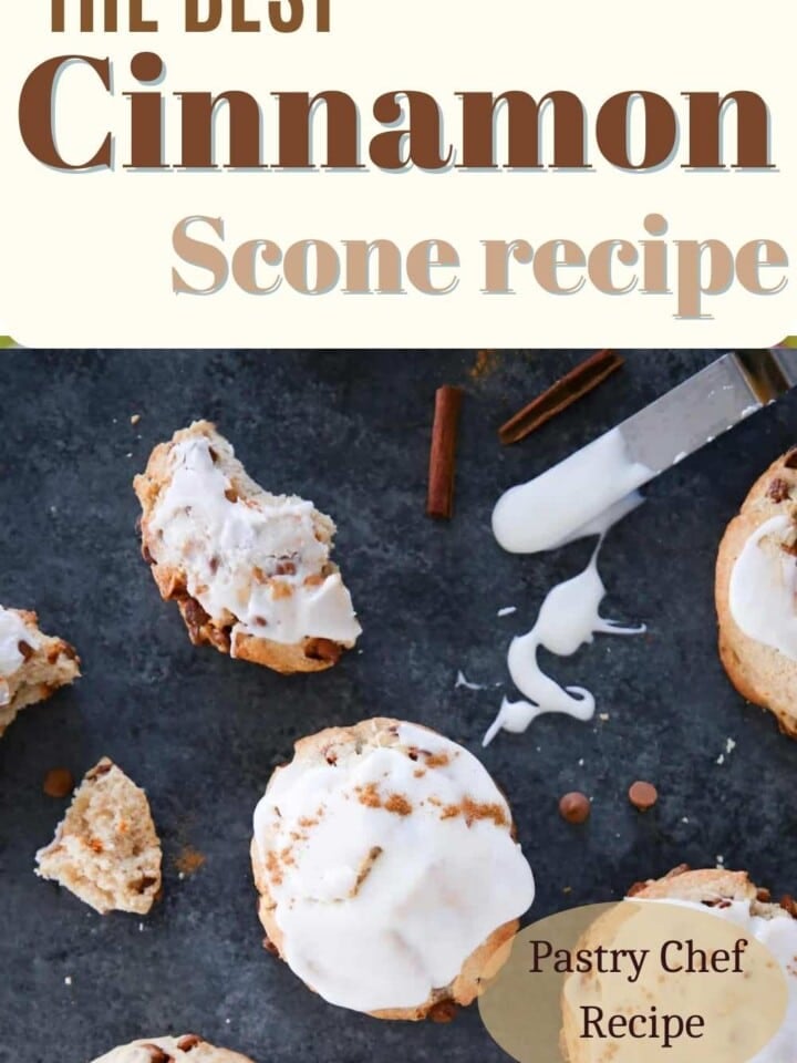 Freshly baked cinnamon scones arranged on a rustic surface.