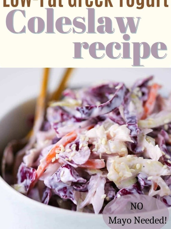 A serving of creamy coleslaw with shredded cabbage and carrots.