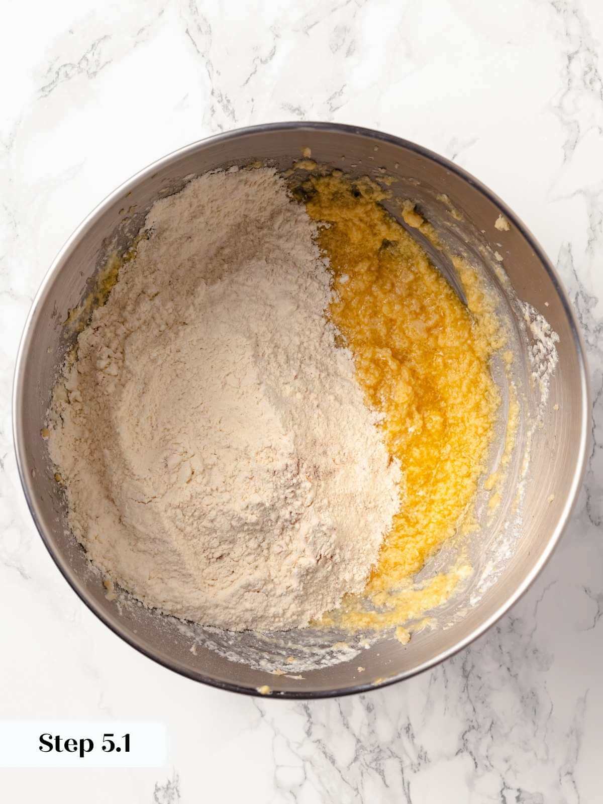 Wet and dry ingredients in separate portions in a bowl, ready to combine.