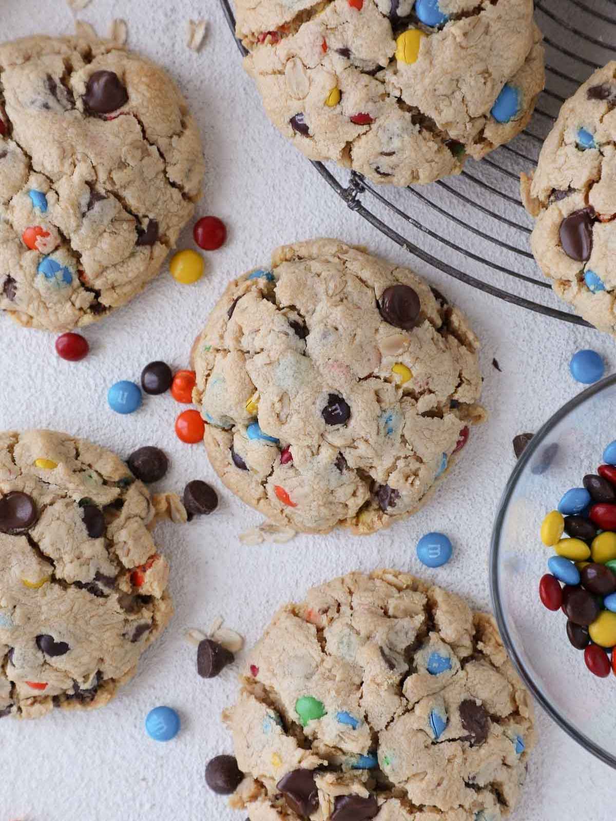 Fully baked monster cookies with colorful M&Ms peeking through the golden brown surface.