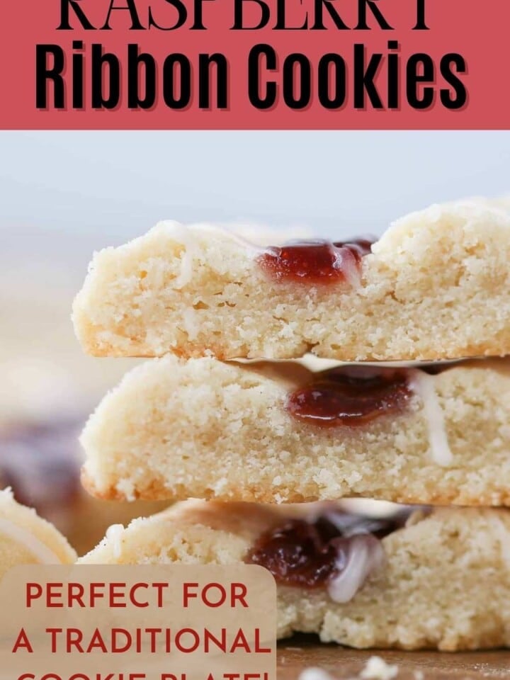 Raspberry ribbon cookies stacked on a wooden board, showcasing their soft texture and fruity filling.