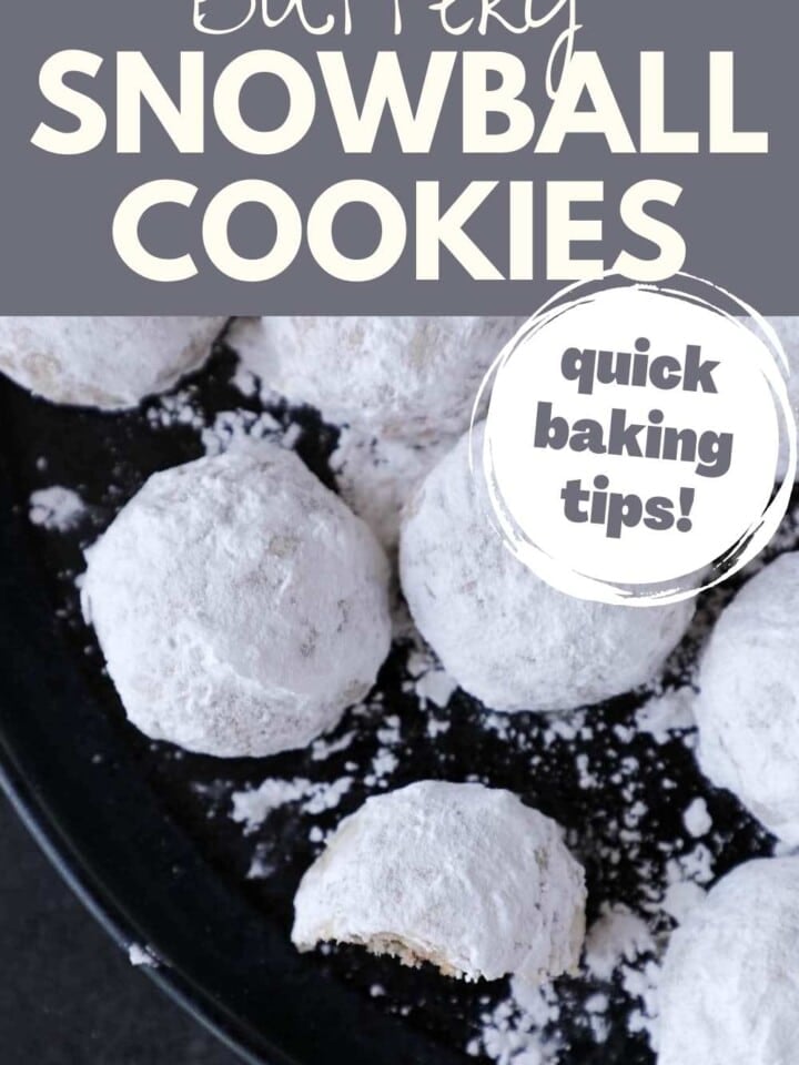 A plate of snowball cookies dusted with powdered sugar, perfect for holiday celebrations.