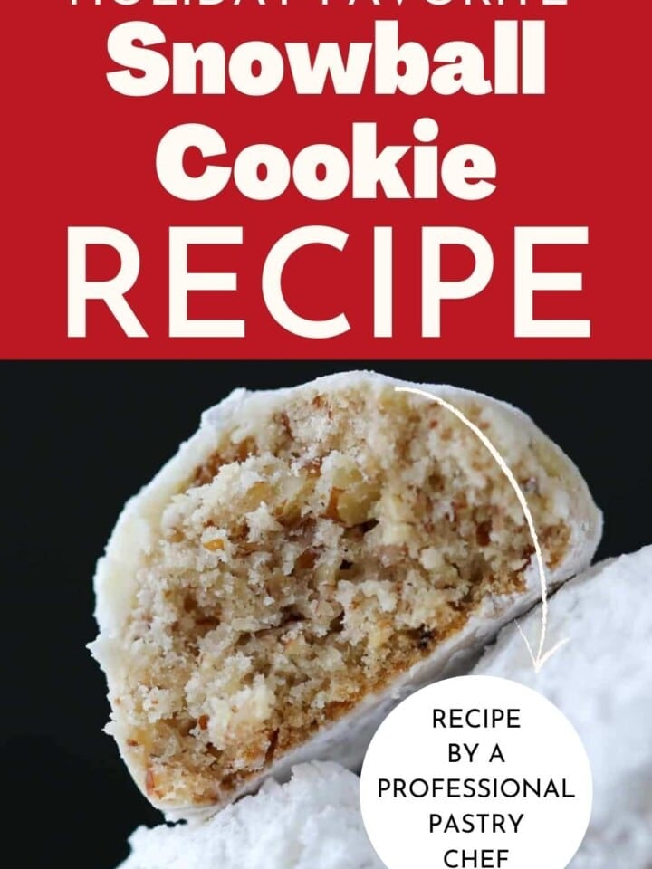 Buttery, nut-filled snowball cookies displayed on a tray, freshly coated in powdered sugar.