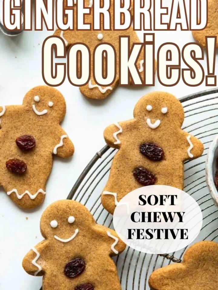 Classic gingerbread cookies with cracked tops displayed on a white counter.