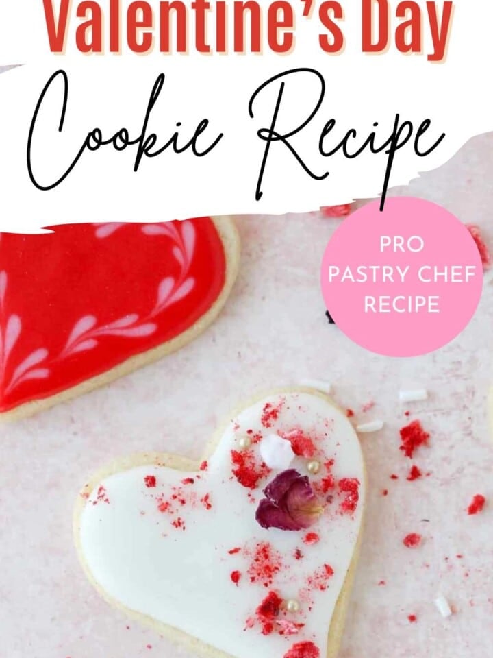 A close-up of sugar cookies with a drizzle of icing and crushed dehydrated strawberries for a fun Valentine’s twist.