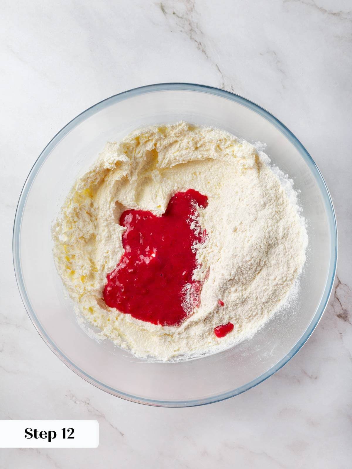 Flour and milk being alternately added to the cupcake batter and mixed gently.