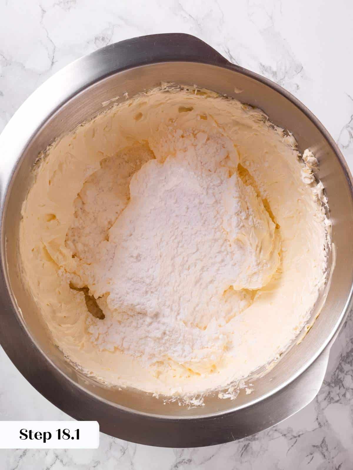 Butter and powdered sugar being creamed together to form a light and fluffy base for buttercream.