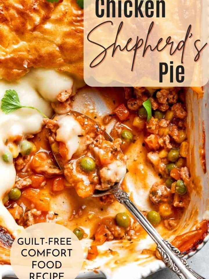 Close-up of a slice of Chicken Shepherd’s Pie showing layers of seasoned ground chicken, rich sauce, and fluffy mashed potatoes.