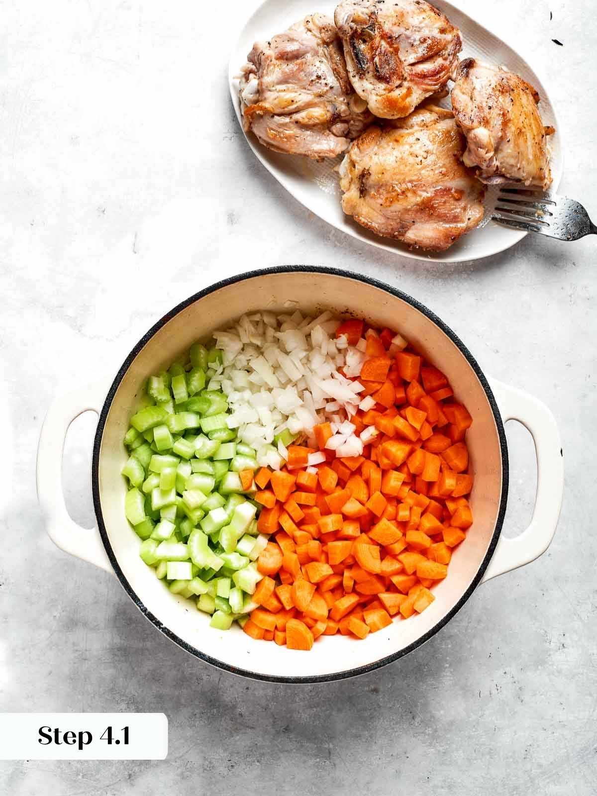 fresh, raw veggies placed into the pot for the soup.