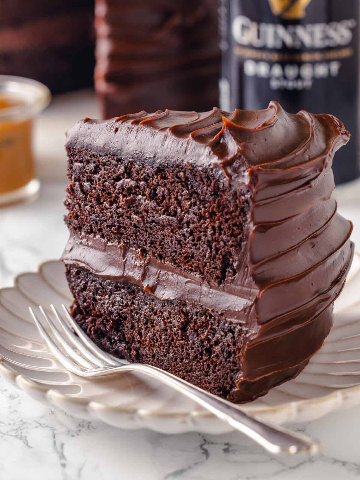 slice of guinness chocolate cake with two layers on plate.