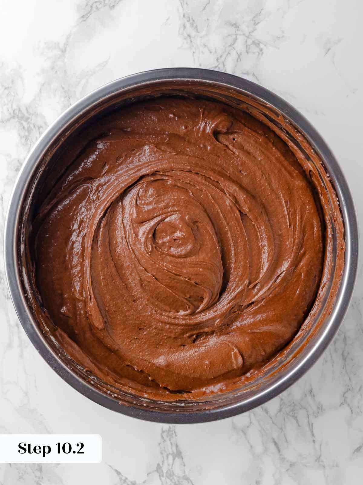 folding chocolate ganache mixture into cake batter.