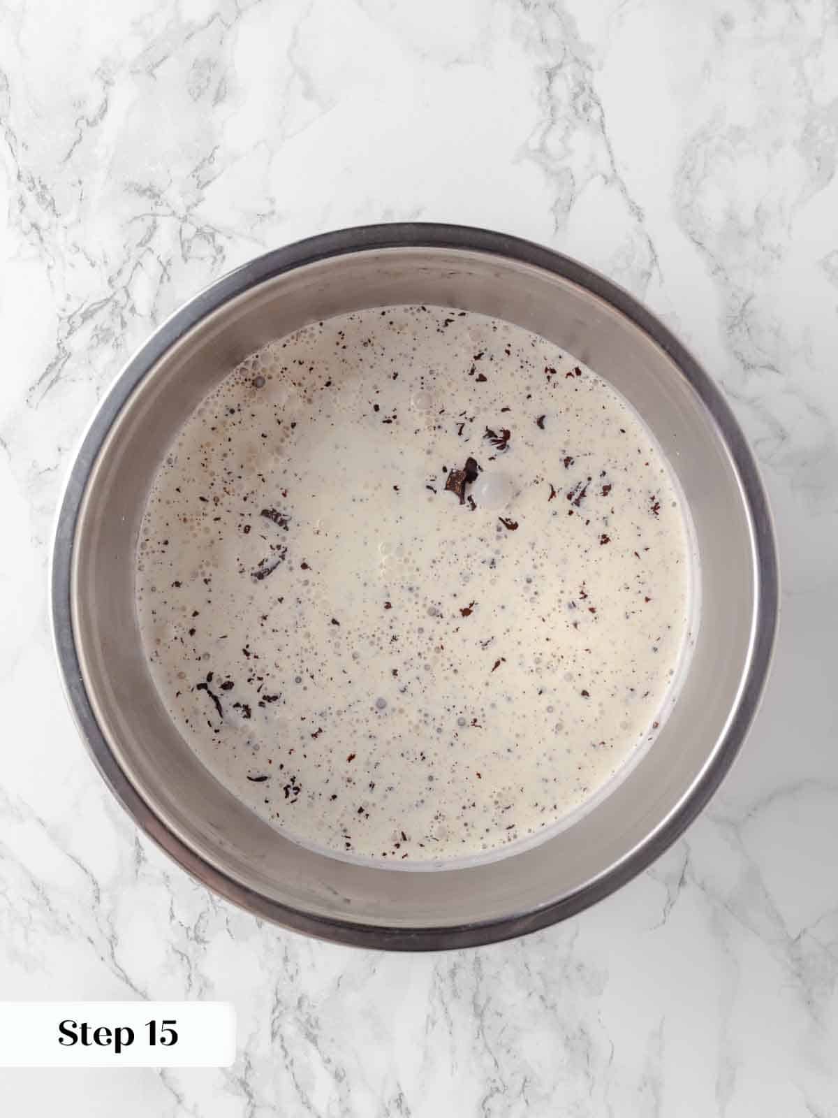 boiling heavy cream poured over chopped chocolate for fudge frosting.