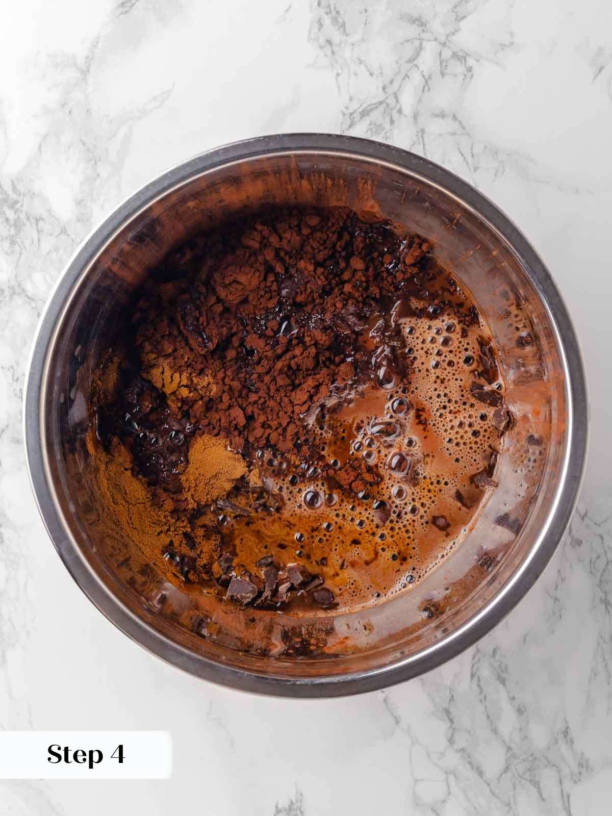 pouring boiling beer over chocolate and cocoa powder.