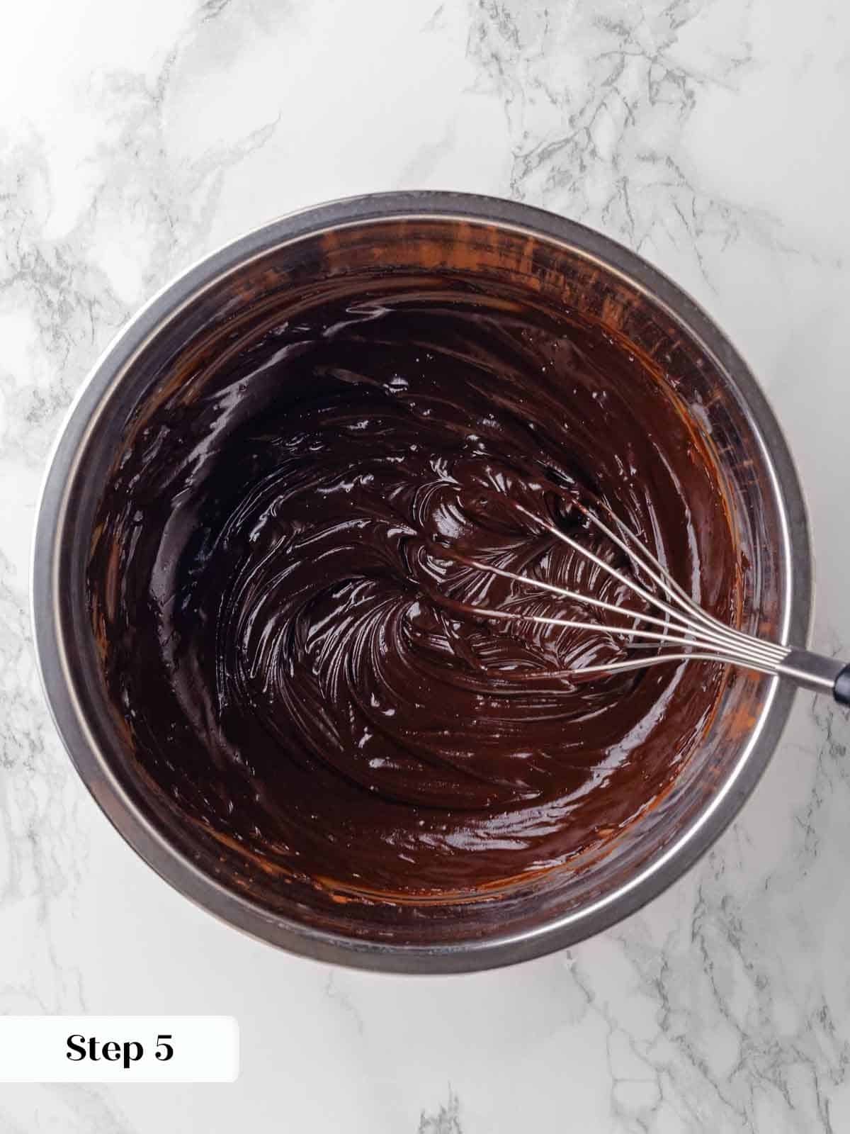 whisking ganache to emulsify for guinness chocolate cake batter.