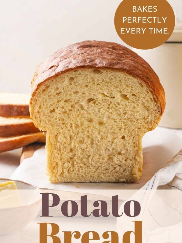 A loaf of homemade potato bread sliced to show inside.