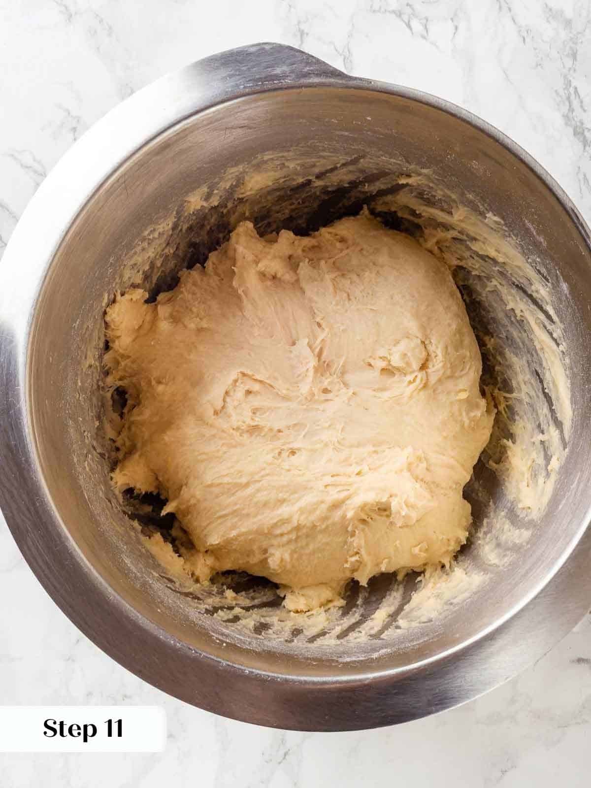 Flour and sugar added to a mixing bowl with wet ingredients.