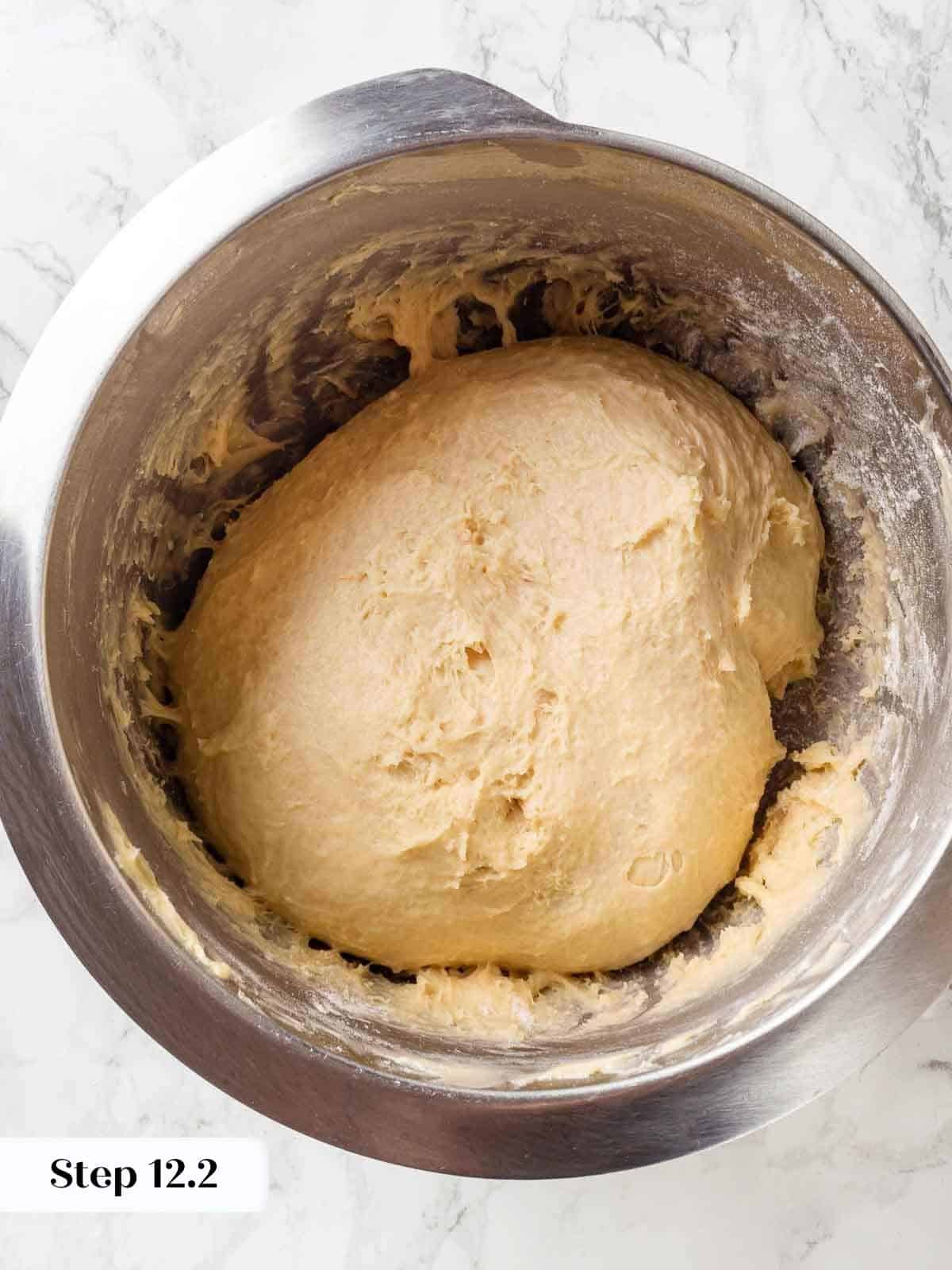 Soft butter incorporated into the dough, giving it a smooth and elastic texture.