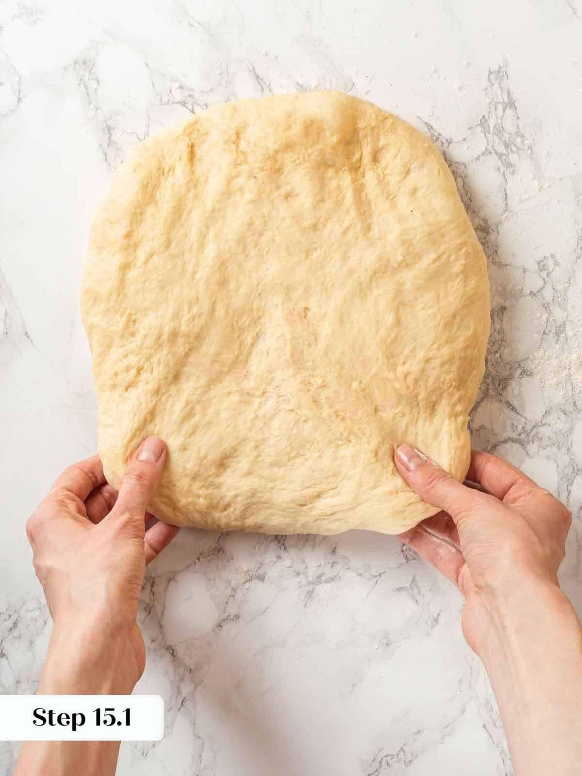 A smooth, even rectangle of dough before being rolled and placed in the loaf pan.