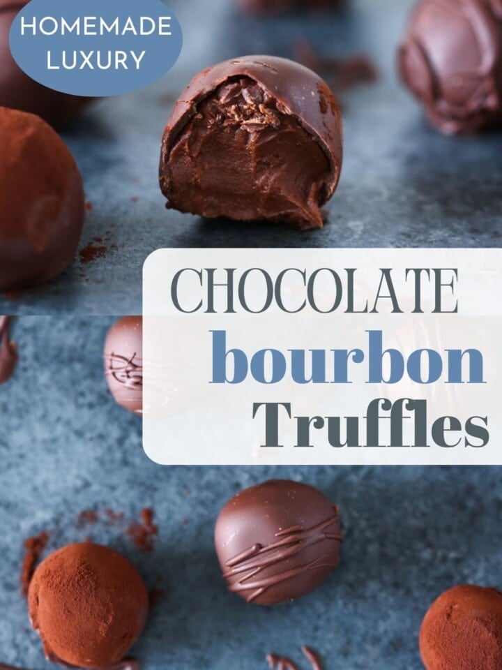 A counter filled with cocoa-dusted chocolate bourbon truffles, with a bite taken out of one.