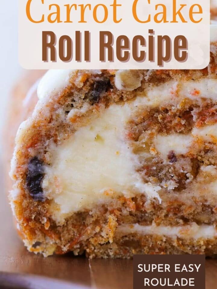 Close-up of a moist carrot cake roll filled with a thick swirl of frosting.