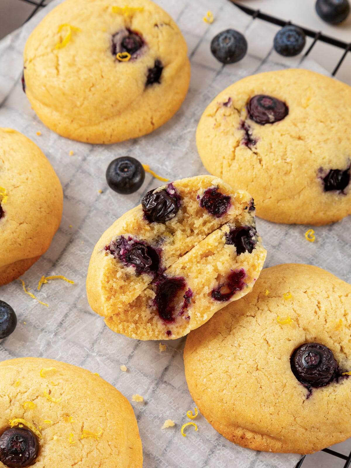 The interior of a chewy lemon blueberry cookie with fresh berries.