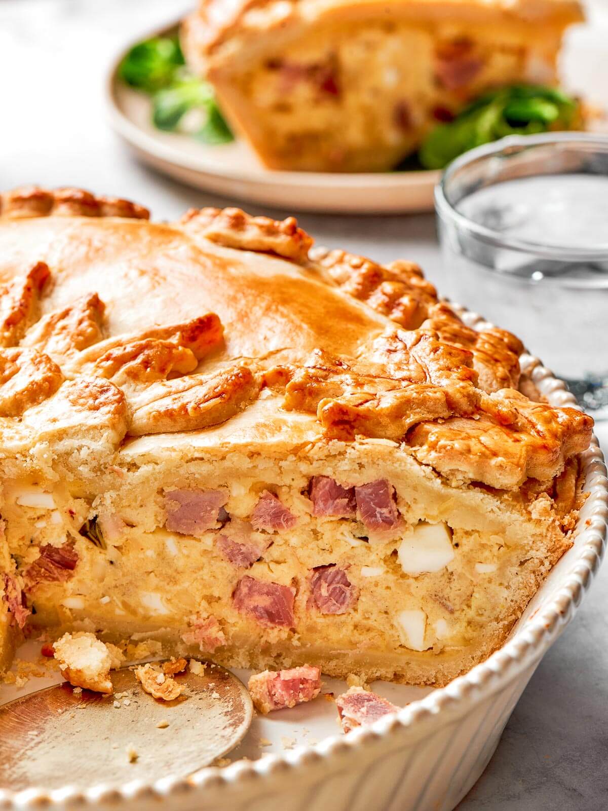 Slices of soppressata and salami embedded in the cheesy ricotta filling.