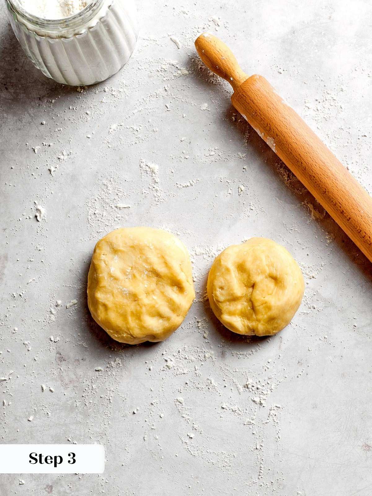 The pie dough portioned into two pieces for the top and bottom crust.