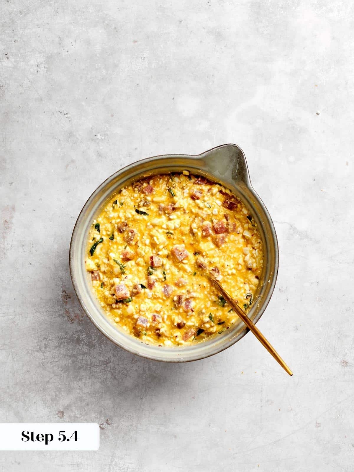 A creamy, cheesy filling prepped and ready to be spooned into the crust.