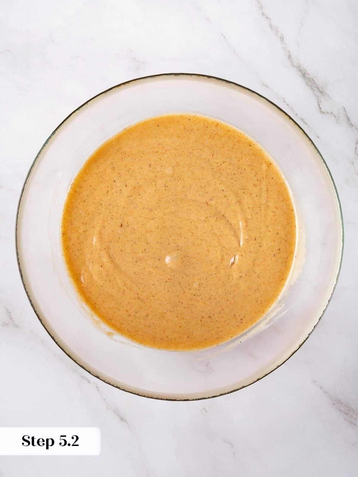 Fully mixed carrot cake batter with flour fully blended in.