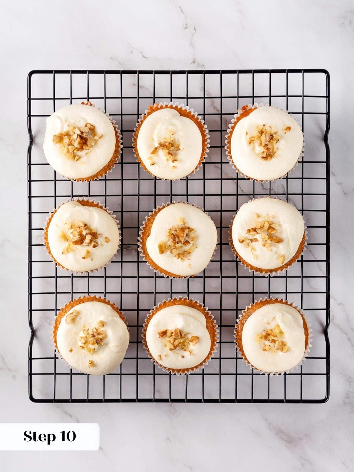 A set of carrot cupcakes after being frosted and ready to serve.