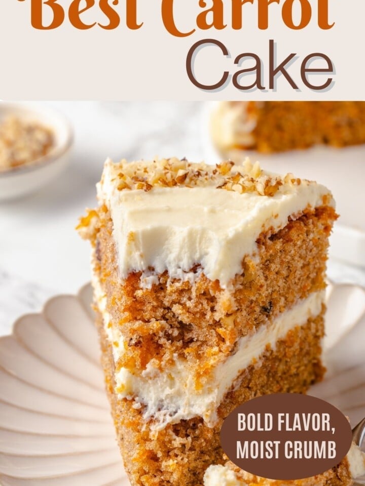 Two-layer carrot cake with chopped walnuts and cinnamon flecks.